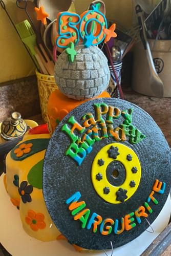 Cookies and cream. Measures 12 inch diameter with two layers and two tiers.  Fondant decorations.