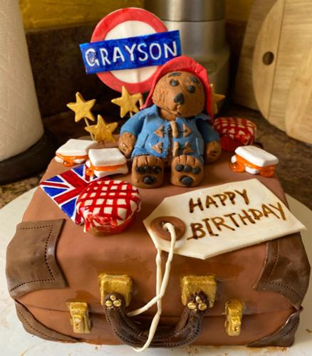 Chocolate cake with chocolate frosting and fondant decorations.  Measures 11x14 inches, two layers.