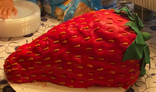 Strawberries & cream flavor.  Large carved cake with fondant decorations. Measures: 12 inches width, 24 inches length, 12 inches height.  